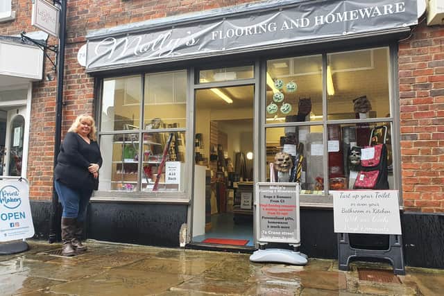 Lousie Brough  outside her daughter's shop Molly's Flooring and Hardware