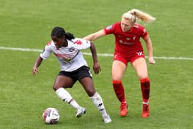 Freda Ayisi of Lewes battles for possession with Ceri Holland of Liverpool (Photo by Lewis Storey/Getty Images)