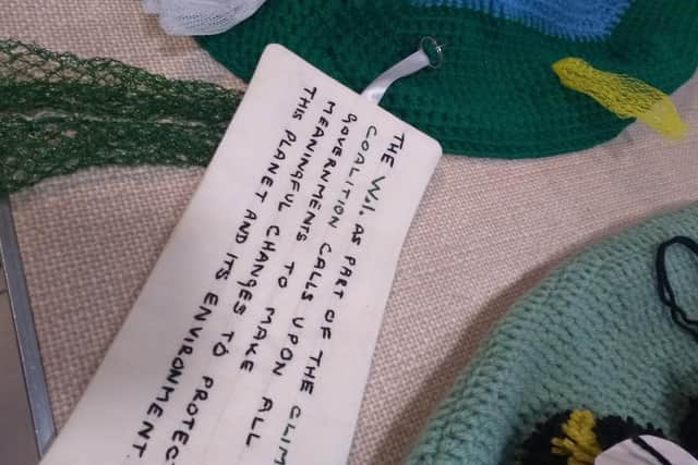 Horsham Normany WI make post box toppers to raise awarness of climate change.