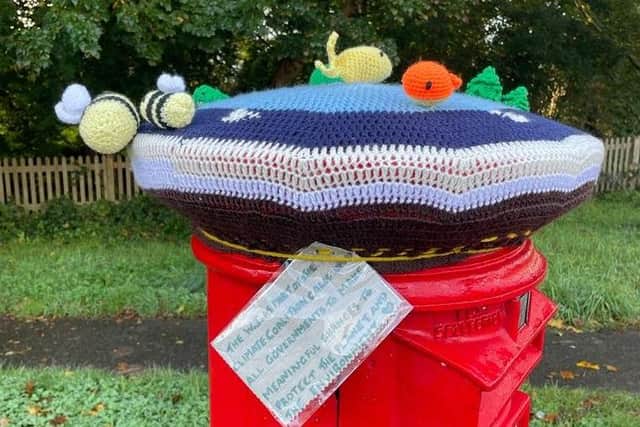Horsham Normany WI make post box toppers to raise awarness of climate change.