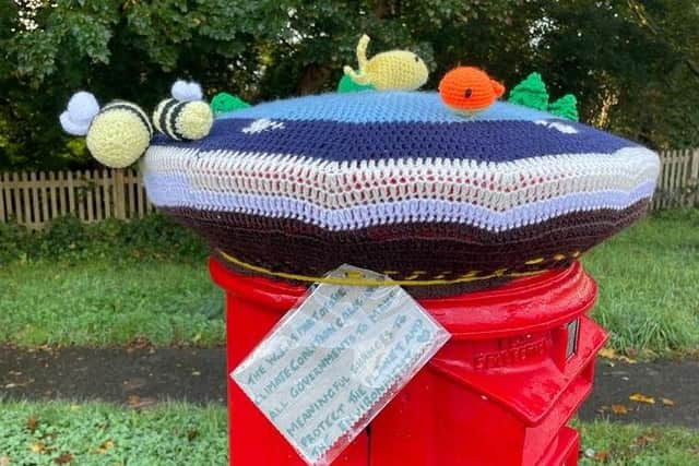 Horsham Normany WI make post box toppers to raise awarness of climate change.