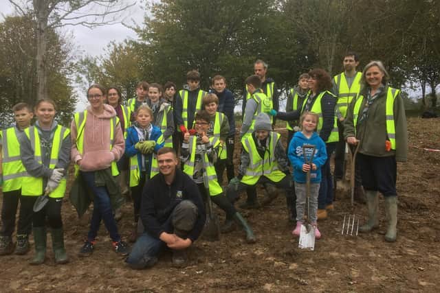 A group of 10th Haywards Heath Scouts and parents planted about 1,300 daffodil bulbs on a bank on Cuckfield Golf Course.