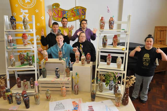 Ceramicist Adam Johnson and the Superstar artists with the exclusive Superstar Arts vase collection. Picture: Steve Robards SR2111022