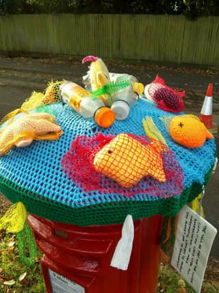 Horsham Normany WI make post box toppers to raise awarness of climate change.