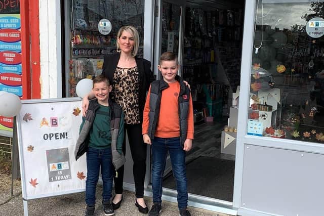 Louise Citroni with her sons Ashley and Bradley outside her shop, ABC Shoreham, which she named after them