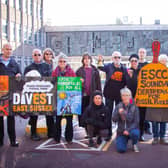 Campaigners 'sound the death knell for fossil fuels' outside of County Hall (Photo by Emily Mott)
