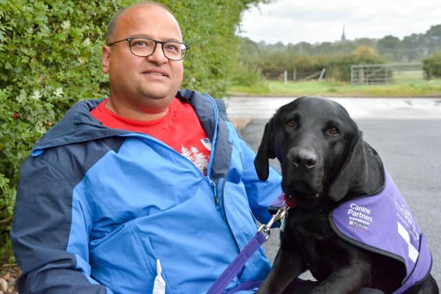 Majid and his assistance dog Oxford.