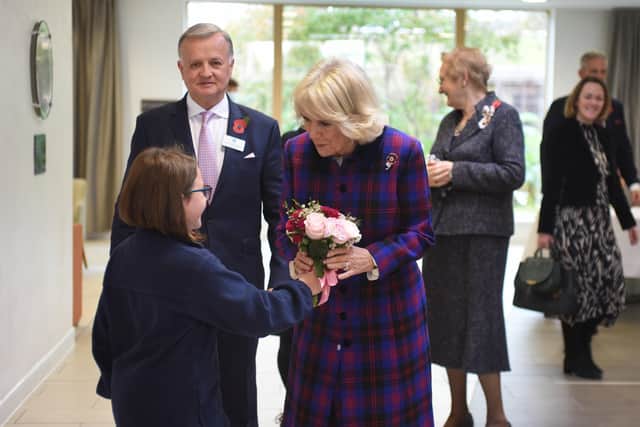 The Duchess of Cornwall visits St Wilfrid's Hospice in Eastbourne for its 40th anniversary.
Holly giving the posy to the Duchess.  Photo by Justin Lycett. SUS-210411-162542001