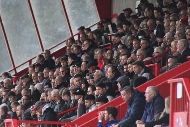 Reds fans watch the FA Cup clash with Tranmere. Picture by Cory Pickford