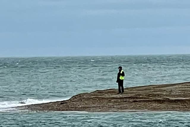 A distant Phil Barber, the geomorphologist on the project, monitoring the effect of the breach