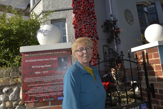 Eileen Digby-Rogers outside her house with the poppy display (Photo by Jon Rigby) SUS-210311-155838008