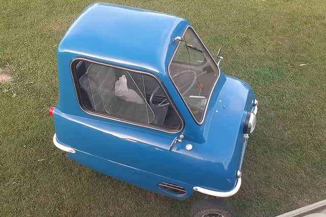 Alex Orchin from Wivelsfield is driving the world's smallest car, the Peel P50, from John o' Groats to Lands' End. Picture: Alex Orchin.
