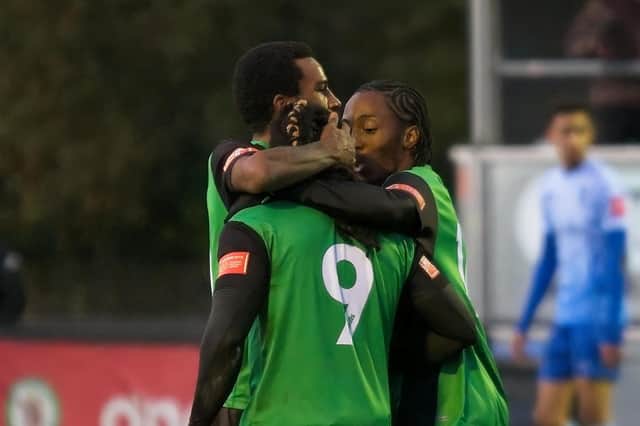 Burgess Hill Town celebrate Michael Uwezu's goal in their thrilling 2-2 draw with Lancing on Saturday. Picture by Chris Neal