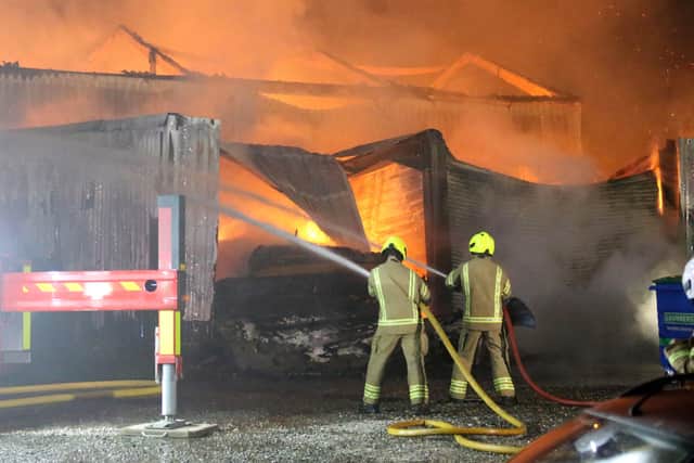 Fire crews battle the blaze at an industrial unit in Station Road, Loxwood