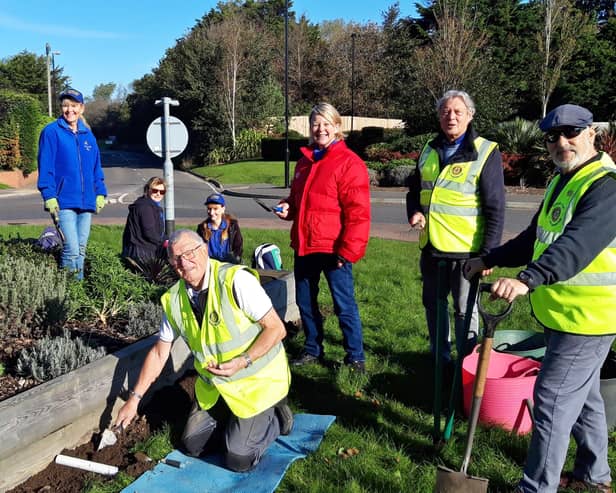 Littlehampton Satellite Rotary Club and the Angmering in Bloom team working on the roundabout in Roundstone Road, Angmering