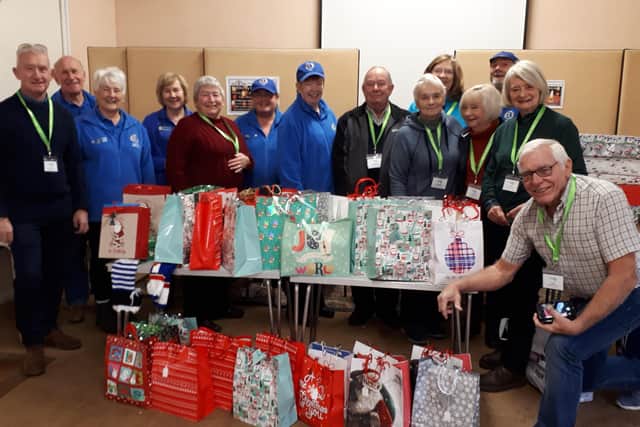 Adur East Lions donating Christmas food bags to Shoreham Foodbank. The club has increased the amount it donate to the foodbank to £100 a month and now also donates £100 a month to Fishersgate Foodbank.