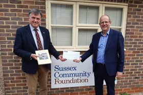 Dr Tim Fooks, former High Sheriff of West Sussex, presents the proceeds of his book A Year Like No Other, a cheque for £2,000, to Kevin Richmond, chief executive of Sussex Community Foundation