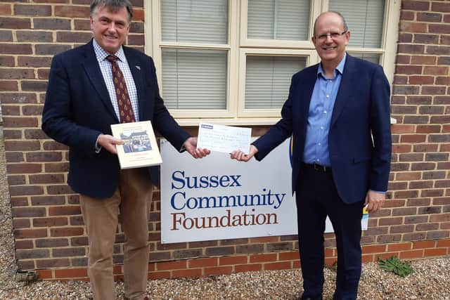 Dr Tim Fooks, former High Sheriff of West Sussex, presents the proceeds of his book A Year Like No Other, a cheque for £2,000, to Kevin Richmond, chief executive of Sussex Community Foundation
