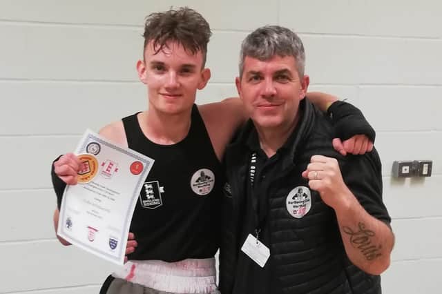Jude Whitworth, Southern Counties Youth under-64kg development champion, with coach Ady Clark