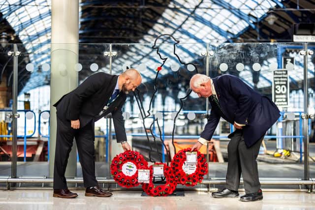 Ian Henderson (right) and Nick Parker, Southern head of stations lay wreaths on Brighton Station concourse                             Photo: Ciaran McCrickard/PA Wire