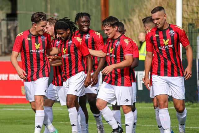 Lewes' men's team celebrate netting against Enfield Town. Pictures by James Boyes