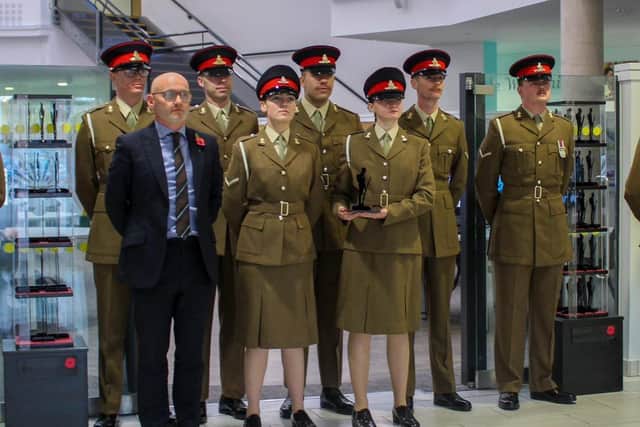 Headteacher David Oakes with troops from 58 Battery Eyres Company. Photo: Tilly Smith