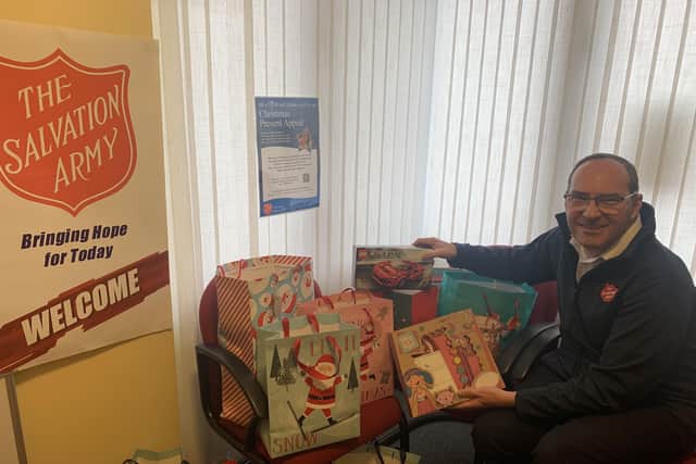 Major Iain Stewart, leader of Horsham Salvation Army, begins to sort gifts for children and families this Christmas