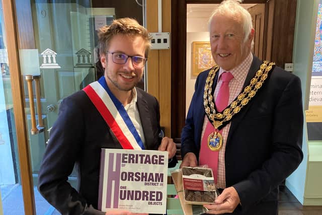 Mayor of Saint-Maixent L’Ecole, Monsieur Stephane Baudry and Horsham District Council  chairman David Skipp exchange gifts