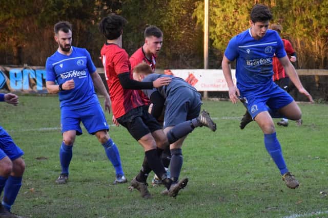 Action from last season's clash between AFC Uckfield Town and Broadbridge Heath. Picture by Mike Skinner