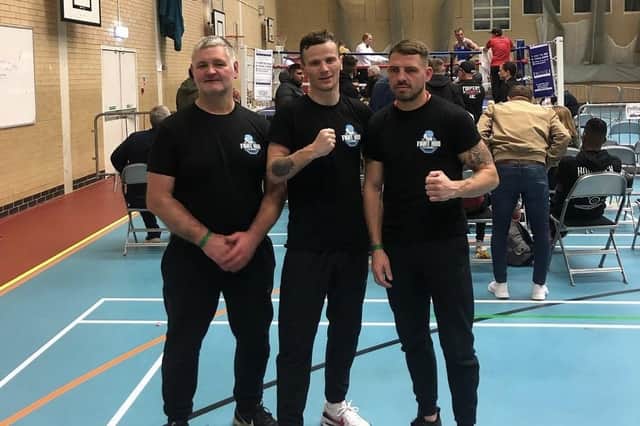 From left: Felbridge Fight Hub head coach Paul Devlin, boxer Hayden Bulloch and gym owner James Verbeeten