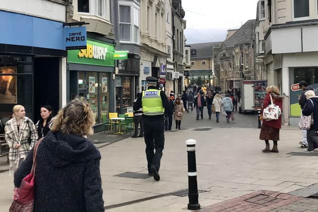 A police officer on patrol in Hastings town centre.