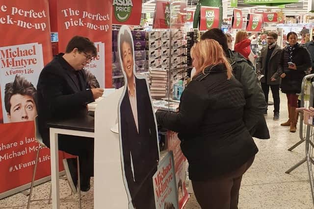 Michael McIntyre signing copies of his new book for Eastbourne fans on November 16. Signed cardboard cut-outs of the comedian and a signed copy of his new book are being auctioned to raise money for St Michael's Hospice. SUS-211117-153610001