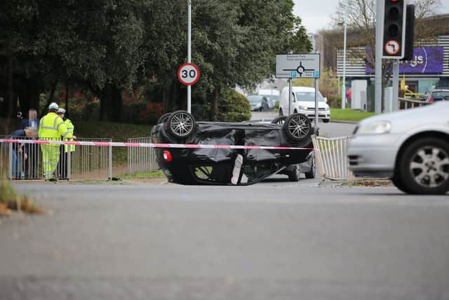 A car was pictured on its side near the Lyons Farm retail park. Photo: Eddie Mitchell