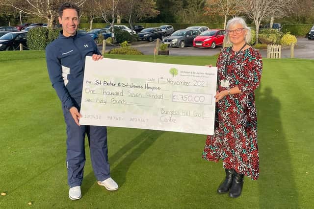 Golf manager Bruce Whalley presents a cheque to Wendy Agate from St Peter and St James Hospice. Picture: Burgess Hill Golf Centre.