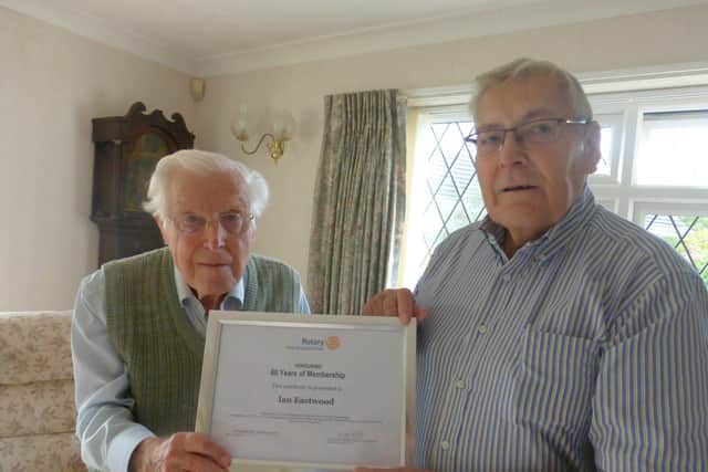 Geoff Watts, Littlehampton Rotary Club secretary, presents Ian Eastwood with a certificate marking 60 years' service