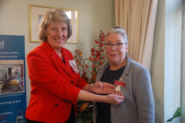 The Lord-Lieutenant of West Sussex presenting Jackie Woollet, senior house manager at Oakshade in Chichester, with a BEM award.