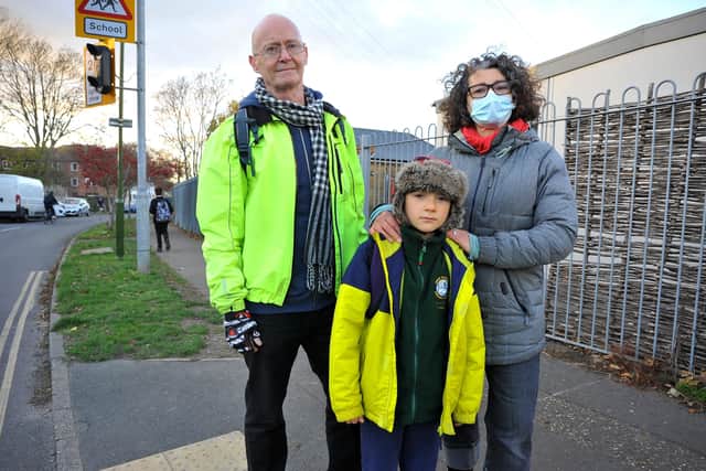 Road safety concerns at Swiss Gardens Primary School. Emma Turner and her son at the crossing point where he was in an incident on the road outside the school, and Cllr Kevin Boram. Pic S Robards SR2111221 SUS-211122-170121001