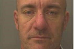 Bradley Dobson, 48, who has links to the Hastings and Rye areas, is wanted in connection with breaching his bail conditions. Picture: Sussex Police.