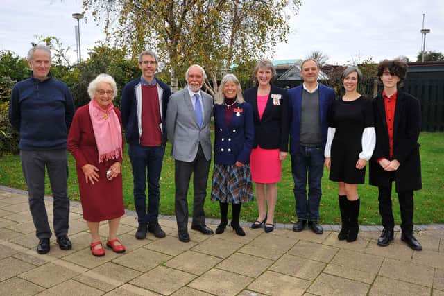 Celia Powis and the Lord-Lieutenant of West Sussex, Mrs Susan Pyper, surrounded by Celia's family. Picture: Steve Robards SR2111242