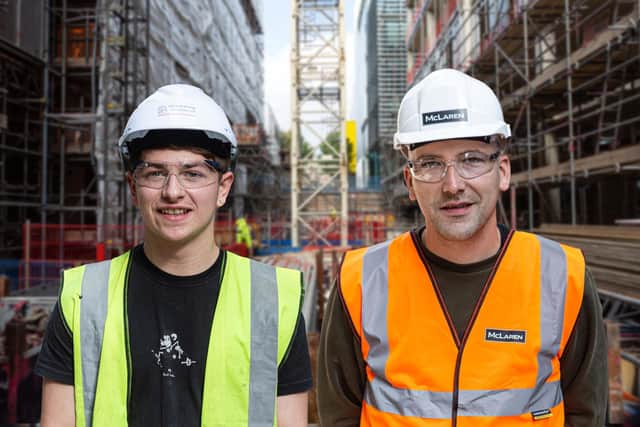 Two of the employees, Florin Macu (right) and Charlie Sole (left)