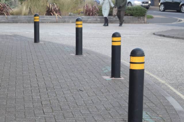 Bollards at The Street, Rustington, outside NatWest, Classix and SLH Cleaners