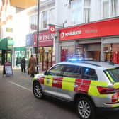 Man superglues himself to counter in Vodafone store in Montague Street Worthing this morning. Photo: Eddie Mitchell