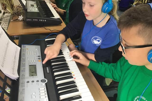 Students enjoy learning the keyboard