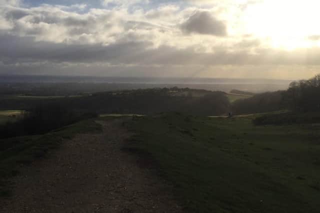 Stunning views to Shoreham and Worthing from Cissbury Ring as storm winds swirl SUS-211128-125608001