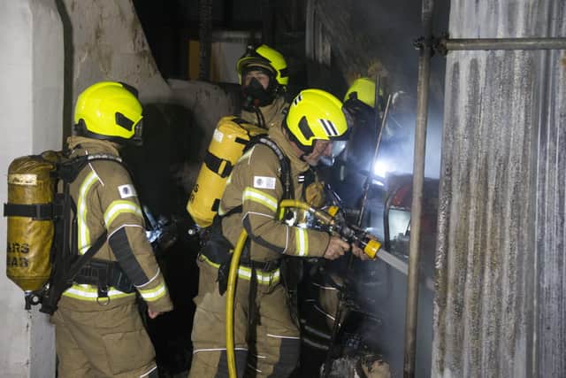 Two men were treated at hospital for the effects of smoke inhalation. Photo: Eddie Mitchell SUS-211128-144340001
