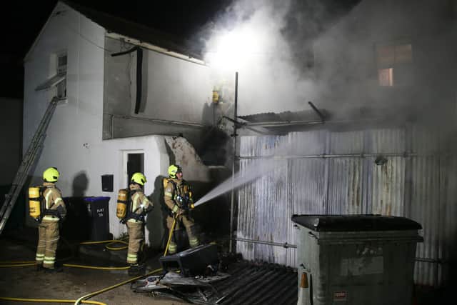 Officers believe the fire, in a store building at the rear of a shop in Brighton Road, Worthing, was started deliberately. Photo: Eddie Mitchell SUS-211128-144356001