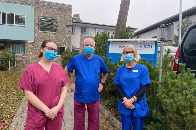 Maurice Adams (middle); deputy provincial grand master for the Sussex Freemasons with Lisa Craig, Senior Occupational Therapist on the Day ward (blue outfit) and Cerys Jones