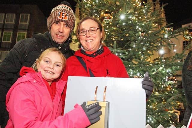 Local hero Gabby Spandley with her Parents Richard and Ellen, as she is about to turn the Christmas lights on
