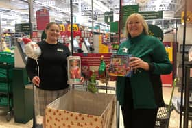 Alison Whitburn, community champion, and Helena Sherriff, one of the managers, with toys donated at Morrisons Littlehampton for the V2 Radio Christmas Toy Appeal