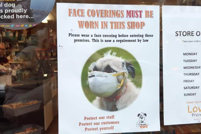 Love Pets in Beach Road has a sign on the door informing people to wear their masks before entering